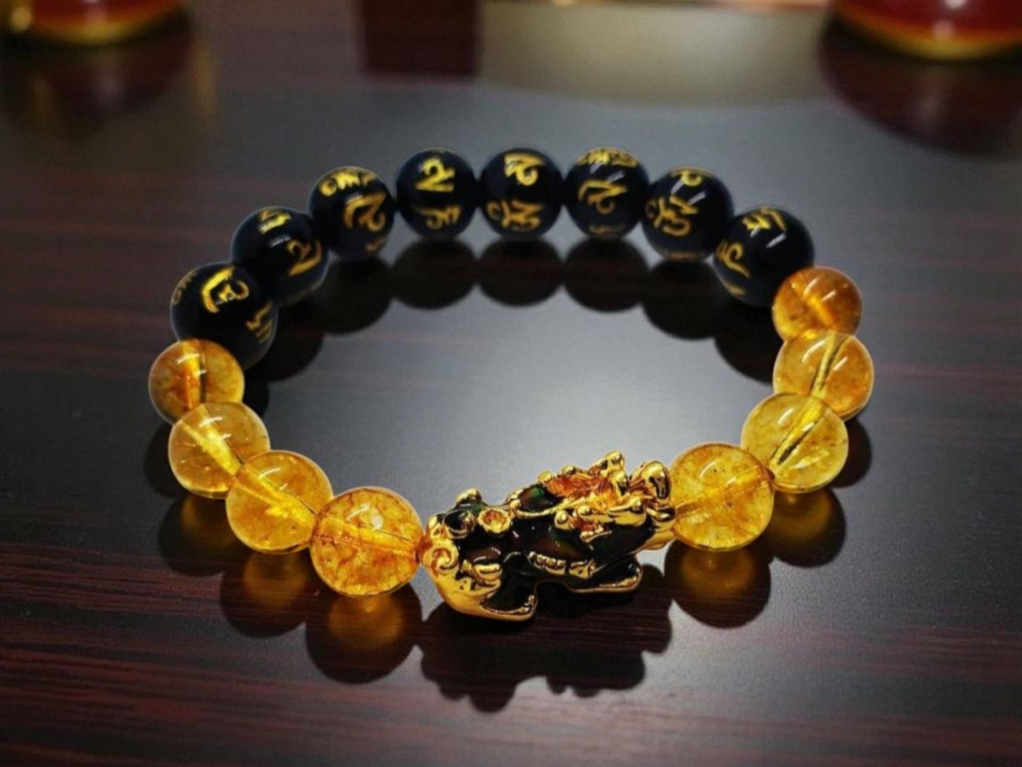 Citrine Obsidian Pixiu bracelet designed for wealth attraction and protection, handcrafted with natural crystals. This Feng Shui-inspired healing jewelry piece combines the powerful energy of citrine and obsidian stones, believed to enhance prosperity, ward off negative energy, and bring balance. Suitable for men and women, it makes a meaningful gift for those seeking spiritual harmony and positive energy in daily life.