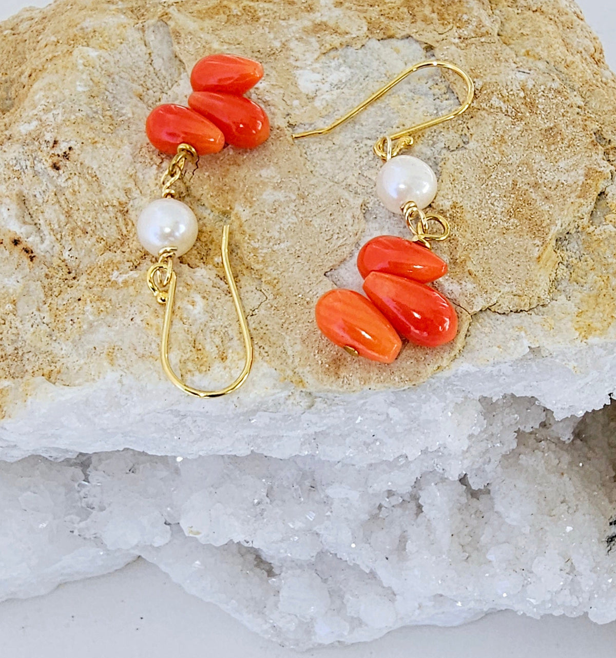 Handmade orange coral and pearl drop earrings featuring intricate beaded dangle design, perfect for women who love boho style jewelry. These statement earrings combine vibrant coral beads with elegant pearls, creating a unique accessory ideal for gifting or adding a pop of color to any outfit. Lightweight and comfortable, these coral jewelry earrings are perfect for casual or special occasions, making a bold fashion statement.