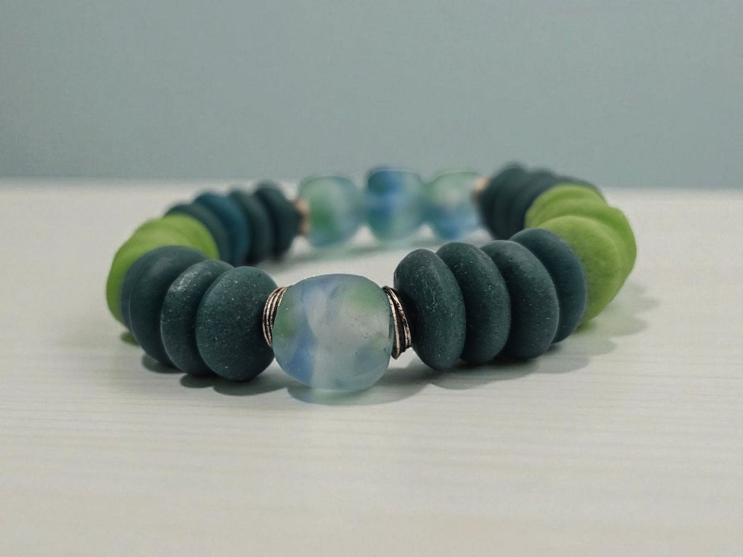 Multi Color Ashanti Blue Green Glass Beaded Bracelet featuring vibrant, handcrafted African trade beads in a bold, spiritual design. This colorful boho statement bracelet is inspired by traditional Ashanti craftsmanship, blending rich cultural heritage with modern style. Perfect handmade jewelry gift for women who love unique, meaningful accessories. Ideal for birthdays, holidays, or special occasions. A stunning piece full of color, energy, and artisan charm.