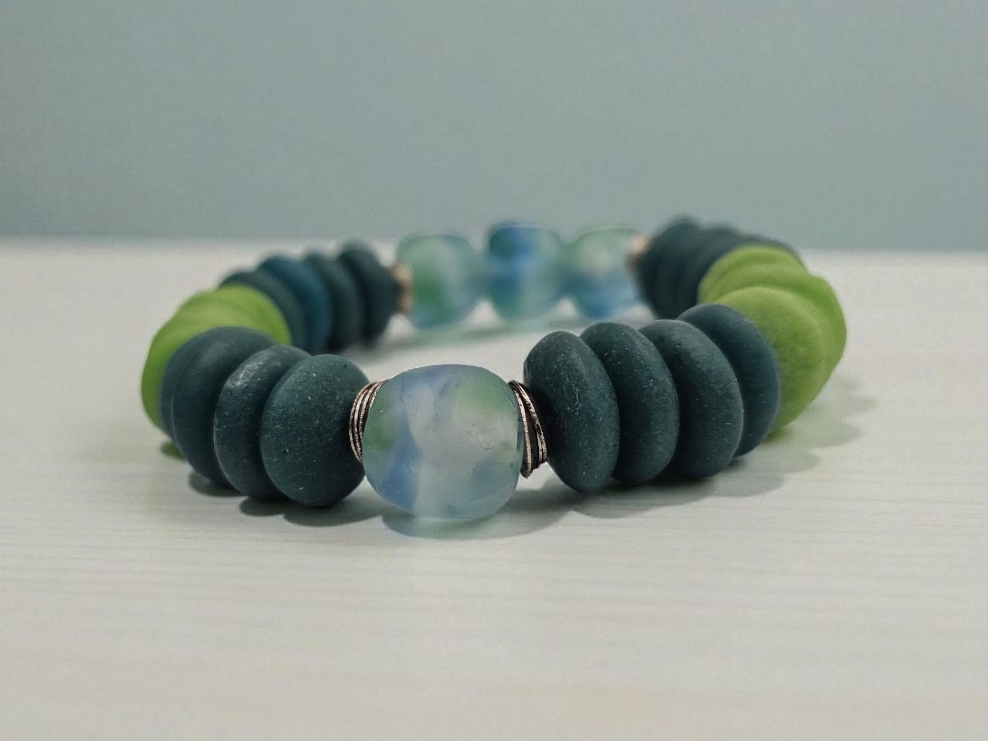 Multi Color Ashanti Blue Green Glass Beaded Bracelet featuring vibrant, handcrafted African trade beads in a bold, spiritual design. This colorful boho statement bracelet is inspired by traditional Ashanti craftsmanship, blending rich cultural heritage with modern style. Perfect handmade jewelry gift for women who love unique, meaningful accessories. Ideal for birthdays, holidays, or special occasions. A stunning piece full of color, energy, and artisan charm.