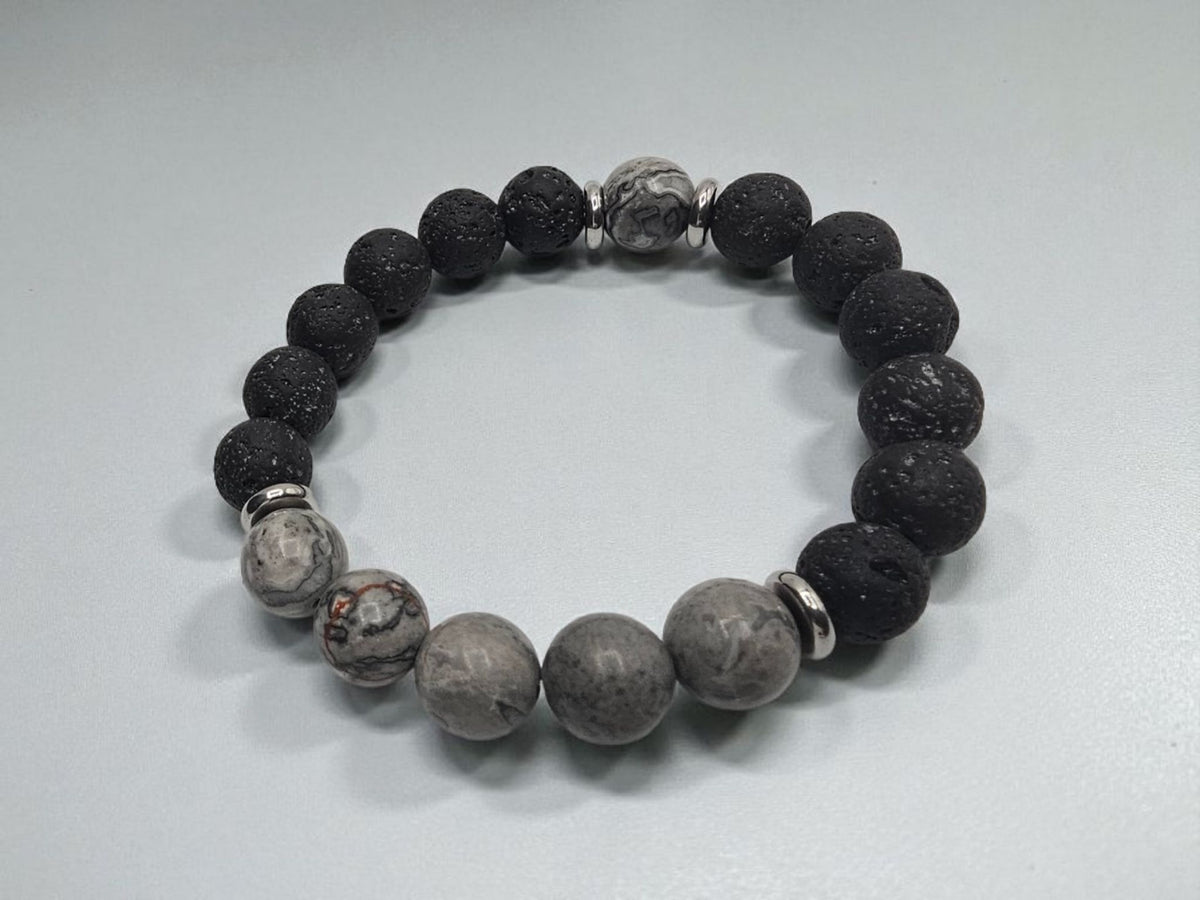 Jasper Lava Stone Diffuser Bracelet handcrafted for men, featuring natural jasper and porous lava stones perfect for essential oil diffusion. This chakra-inspired jewelry piece promotes balance, grounding, and positive energy while allowing personalized aromatherapy on the go. Adjustable and durable, it’s ideal for everyday wear, meditation, or mindfulness practices. A thoughtful gift for men who appreciate handmade jewelry, wellness accessories, and stylish, meaningful gemstone bracelets.