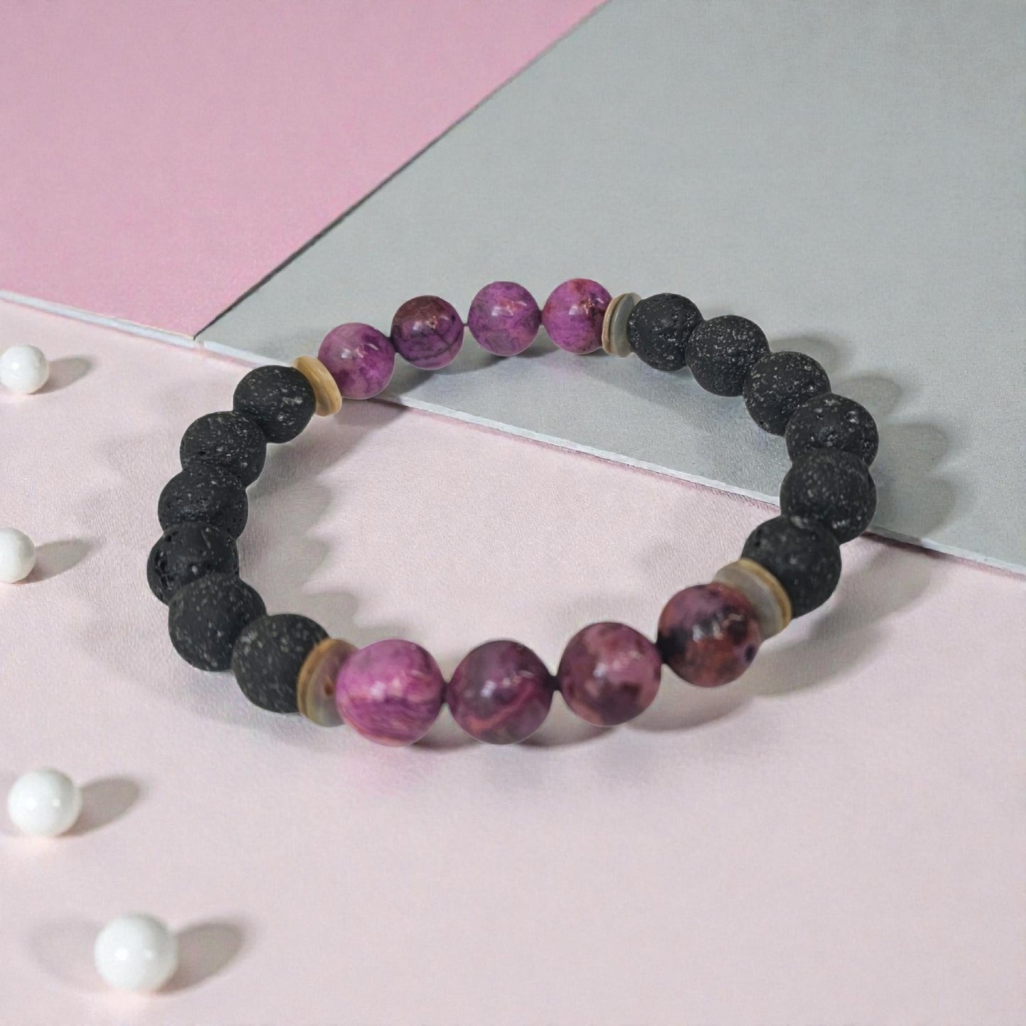 Handmade aromatherapy diffuser bracelet featuring natural purple agate and black lava stones, designed for men and women seeking healing crystal jewelry. This stylish bracelet combines the calming properties of agate with porous lava beads perfect for essential oils, offering both wellness benefits and a fashionable accessory. Ideal as an anniversary gift, this unisex bracelet blends holistic healing with modern handcrafted design.