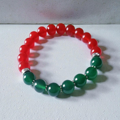Green and Red Onyx Crystal Bracelet featuring handmade beaded design crafted for both women and men. This lucky charm jewelry combines vibrant green and deep red onyx stones, known for promoting abundance, protection, and positive energy. Perfect as a meaningful gift for him or her, this stylish bracelet blends artisanal craftsmanship with spiritual benefits. Lightweight and versatile, it adds a powerful and elegant touch to everyday wear or special occasions.