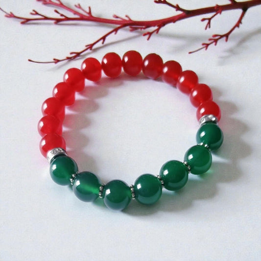 Green and Red Onyx Crystal Bracelet featuring handmade beaded design crafted for both women and men. This lucky charm jewelry combines vibrant green and deep red onyx stones, known for promoting abundance, protection, and positive energy. Perfect as a meaningful gift for him or her, this stylish bracelet blends artisanal craftsmanship with spiritual benefits. Lightweight and versatile, it adds a powerful and elegant touch to everyday wear or special occasions.