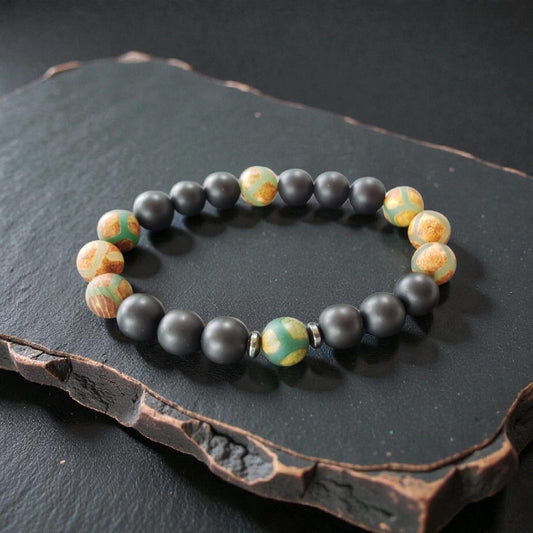Handmade Tibetan-style black onyx and agate bracelet featuring healing gemstones known for their protective and grounding properties. This men’s lucky charm jewelry piece blends traditional craftsmanship with modern style, making it an ideal gift for him. Perfect for everyday wear or special occasions, the bracelet offers both spiritual benefits and a bold, masculine accessory that complements any outfit with its sleek black design.