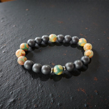 Handmade Tibetan-style black onyx and agate bracelet featuring healing gemstones known for their protective and grounding properties. This men’s lucky charm jewelry piece blends traditional craftsmanship with modern style, making it an ideal gift for him. Perfect for everyday wear or special occasions, the bracelet offers both spiritual benefits and a bold, masculine accessory that complements any outfit with its sleek black design.