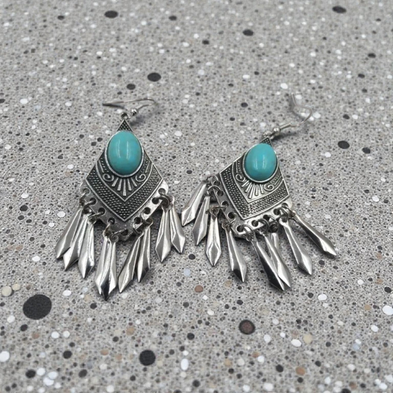 Handmade turquoise tassel earrings featuring natural stone beads and diamond alloy accents, perfect for women who love boho jewelry. These lightweight statement earrings combine vibrant turquoise hues with elegant tassel details for a unique and stylish look. Ideal for casual or dressy occasions, they add a pop of color and texture to any outfit. A beautiful accessory that blends natural elements with chic design, making it a perfect gift or everyday favorite.