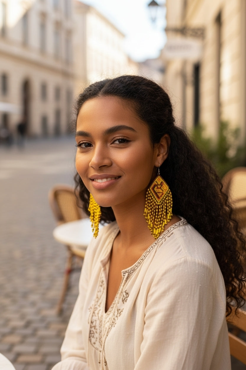 Handmade Yellow Beaded Earrings featuring large Kokopelli designs crafted in boho sterling silver jewelry style. These statement earrings for women showcase vibrant yellow beads combined with intricate Kokopelli motifs, perfect for adding bold, artistic flair to any outfit. Ideal as a unique gift for her, they blend cultural symbolism with trendy, handcrafted elegance. Lightweight and durable, these earrings are perfect for festivals, casual wear, or special occasions.
