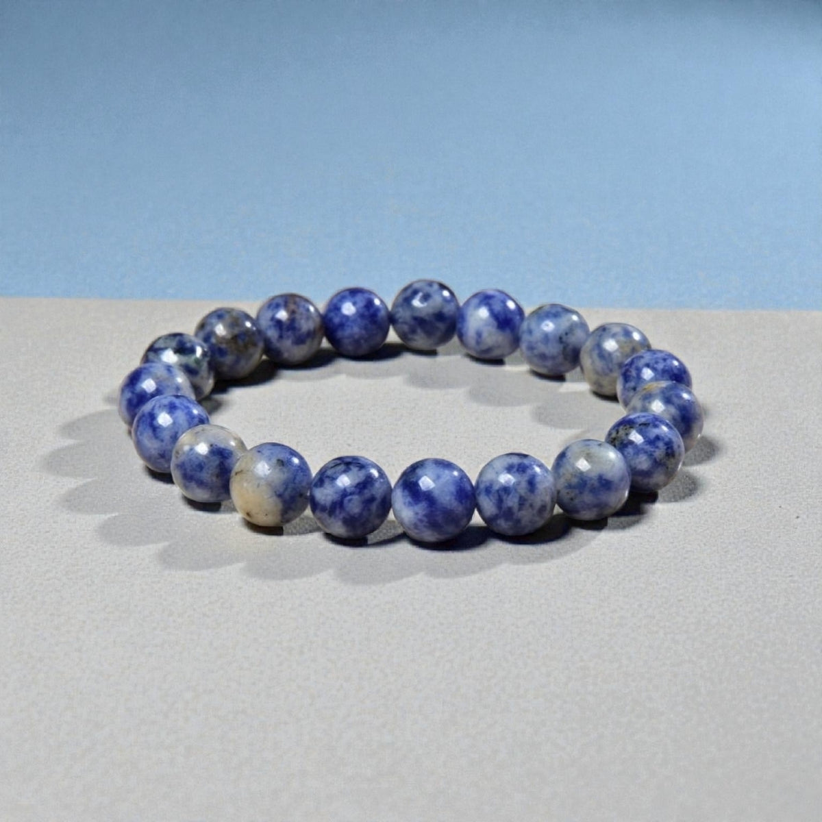 Handmade Sodalite Bracelet featuring natural healing crystals, designed as a mala bead chakra bracelet for meditation and spiritual balance. This Dumortierite-infused jewelry piece promotes calm, clarity, and emotional healing, suitable for both men and women. Perfect as a meaningful gift for mindfulness practitioners, yoga lovers, or anyone seeking positive energy. Stylish, durable, and crafted with care for everyday wear or meditation sessions.