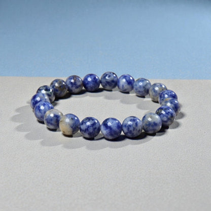 Handmade Sodalite Bracelet featuring natural healing crystals, designed as a mala bead chakra bracelet for meditation and spiritual balance. This Dumortierite-infused jewelry piece promotes calm, clarity, and emotional healing, suitable for both men and women. Perfect as a meaningful gift for mindfulness practitioners, yoga lovers, or anyone seeking positive energy. Stylish, durable, and crafted with care for everyday wear or meditation sessions.