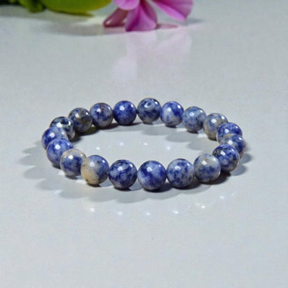 Handmade Sodalite Bracelet featuring natural healing crystals, designed as a mala bead chakra bracelet for meditation and spiritual balance. This Dumortierite-infused jewelry piece promotes calm, clarity, and emotional healing, suitable for both men and women. Perfect as a meaningful gift for mindfulness practitioners, yoga lovers, or anyone seeking positive energy. Stylish, durable, and crafted with care for everyday wear or meditation sessions.