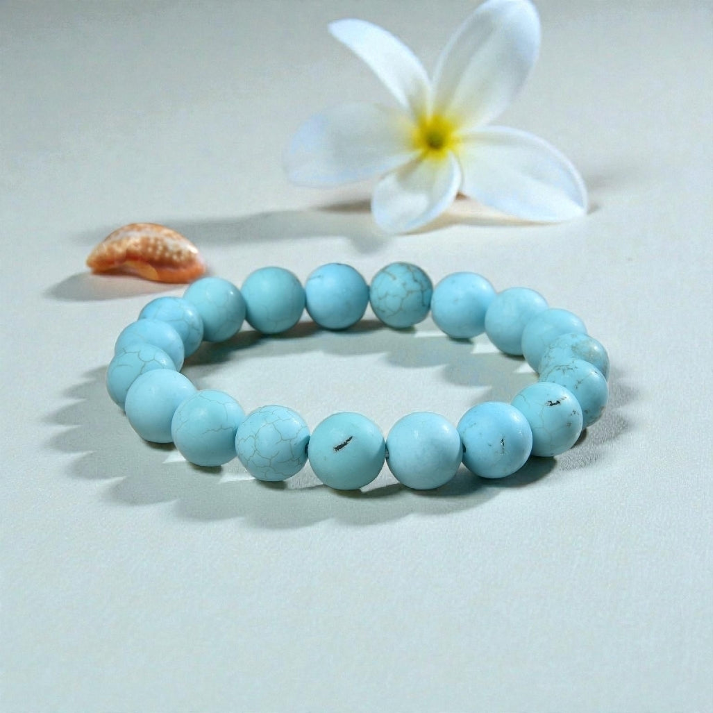 Magnesite Turquoise Stretch Bracelet designed for women and men, featuring blue stone beads known for their healing and chakra-balancing properties. This handcrafted boho crystal jewelry offers both style and spiritual energy, perfect for those seeking natural wellness accessories. Lightweight and comfortable, it makes a thoughtful gift that promotes calmness, positivity, and balance. Ideal for everyday wear, meditation, or adding a vibrant, earthy touch to any outfit.