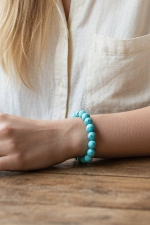 Magnesite Turquoise Stretch Bracelet designed for women and men, featuring blue stone beads known for their healing and chakra-balancing properties. This handcrafted boho crystal jewelry offers both style and spiritual energy, perfect for those seeking natural wellness accessories. Lightweight and comfortable, it makes a thoughtful gift that promotes calmness, positivity, and balance. Ideal for everyday wear, meditation, or adding a vibrant, earthy touch to any outfit.