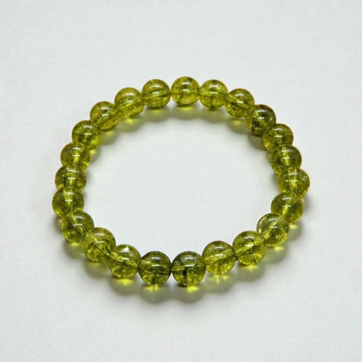 Peridot handmade gemstone healing bracelet featuring natural green peridot stones carefully strung for a balanced and elegant look. Known as a stone of positivity, renewal, and emotional healing, this bracelet offers both beauty and meaning. Designed for everyday wear, it complements boho, minimalist, and spiritual styles. A thoughtful gift for women who appreciate crystal healing jewelry, handcrafted accessories, and vibrant natural gemstones with calming, uplifting energy.