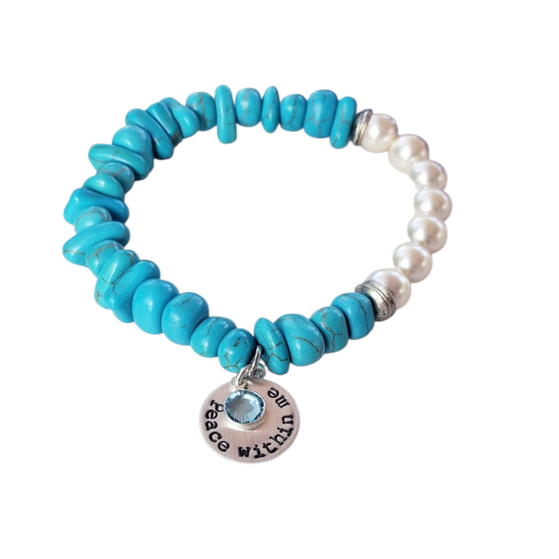 Turquoise & Freshwater Pearl Bracelet featuring a handmade design that blends vibrant turquoise stones with lustrous freshwater pearls. This inspirational healing jewelry is perfect for women seeking balance and positive energy, making it an ideal birthstone gift for December. The statement bracelet combines natural beauty and artisanal craftsmanship, adding a stylish boho touch to any outfit. Lightweight and elegant, it’s suitable for everyday wear or special occasions.