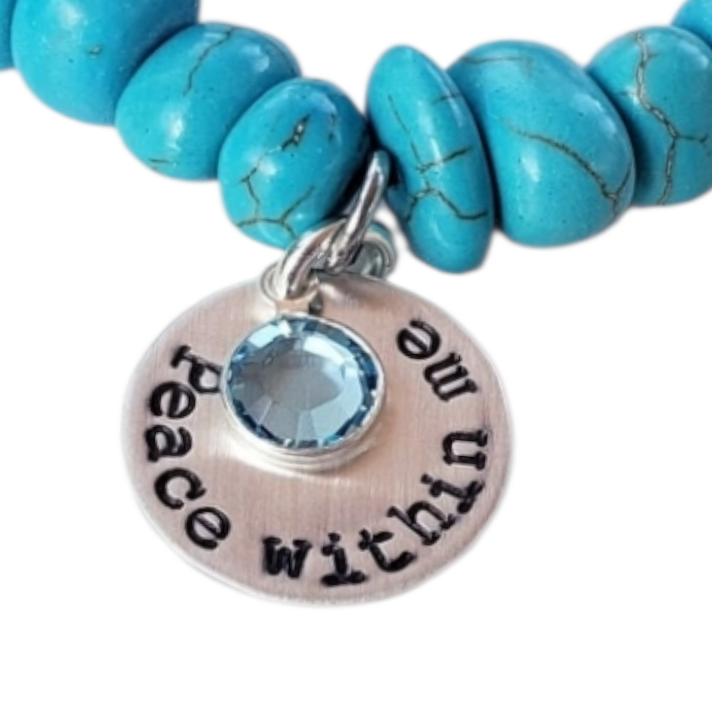 Turquoise & Freshwater Pearl Bracelet featuring a handmade design that blends vibrant turquoise stones with lustrous freshwater pearls. This inspirational healing jewelry is perfect for women seeking balance and positive energy, making it an ideal birthstone gift for December. The statement bracelet combines natural beauty and artisanal craftsmanship, adding a stylish boho touch to any outfit. Lightweight and elegant, it’s suitable for everyday wear or special occasions.