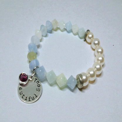 Aquamarine Pearl Bracelet featuring handmade beaded design combining soothing aquamarine stones with lustrous pearls. This inspirational jewelry piece is perfect as a March birthstone gift, symbolizing calmness, courage, and good luck. Ideal for her or as a thoughtful mother’s gift, it blends elegant style with meaningful healing properties. Lightweight and versatile, this bracelet adds a delicate, spiritual touch to everyday wear or special occasions, celebrating love and positive energy.