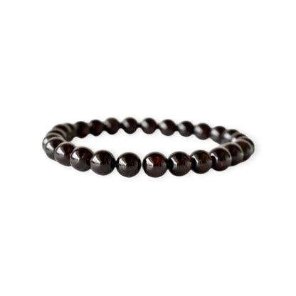 Garnet Handmade Bracelet featuring natural deep red crystal beads crafted into a healing energy design for women and men. This unisex gemstone bracelet promotes strength, passion, and energy balance, making it a meaningful gift for her or him. Perfect for daily wear, meditation, or spiritual wellness, it blends natural beauty with artisan craftsmanship. Lightweight and powerful, this bracelet adds a bold touch to any outfit while supporting emotional and physical grounding.