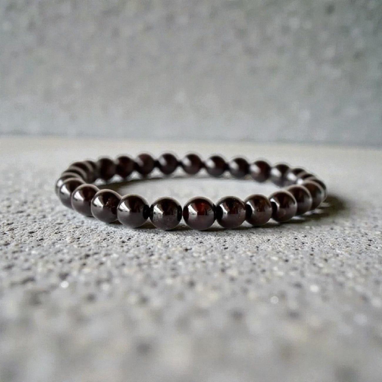 Garnet Handmade Bracelet featuring natural deep red crystal beads crafted into a healing energy design for women and men. This unisex gemstone bracelet promotes strength, passion, and energy balance, making it a meaningful gift for her or him. Perfect for daily wear, meditation, or spiritual wellness, it blends natural beauty with artisan craftsmanship. Lightweight and powerful, this bracelet adds a bold touch to any outfit while supporting emotional and physical grounding.