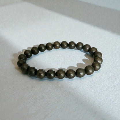 Good Luck Pyrite Bracelet featuring handmade crystal beads designed to attract abundance and positive spiritual energy. This unisex bracelet combines shimmering pyrite stones with artisanal craftsmanship, making it a meaningful gift for both women and men. Lightweight and stylish, it promotes confidence, prosperity, and protection. Perfect for everyday wear or meditation, this abundance bracelet blends healing properties with modern boho jewelry aesthetics.