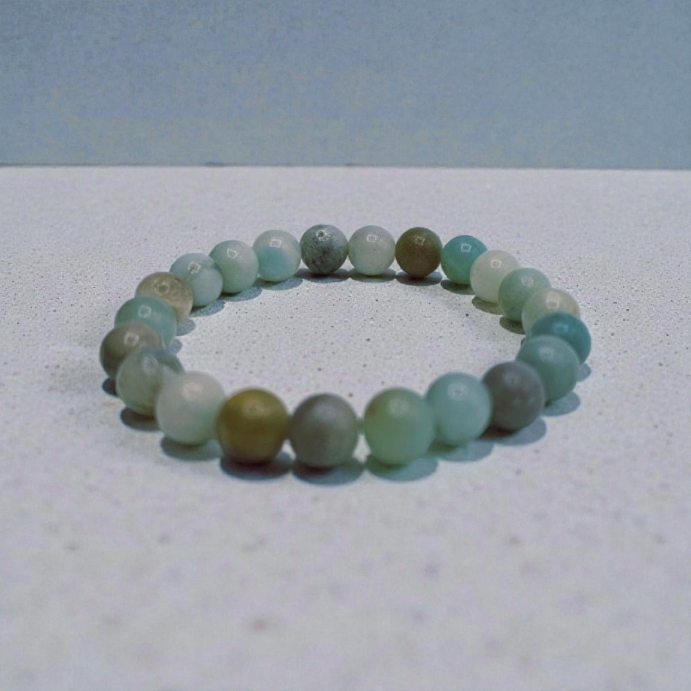 Crystal Handmade Beaded Amazonite Bracelet featuring natural stones crafted into a chakra lucky charm bracelet for both women and men. This spiritual energy jewelry combines soothing amazonite beads known for calming and balancing properties with artisanal beadwork. Lightweight and versatile, it makes a meaningful gift for anyone seeking positive energy, healing, and style. Perfect for everyday wear or meditation, blending natural beauty with holistic wellness.
