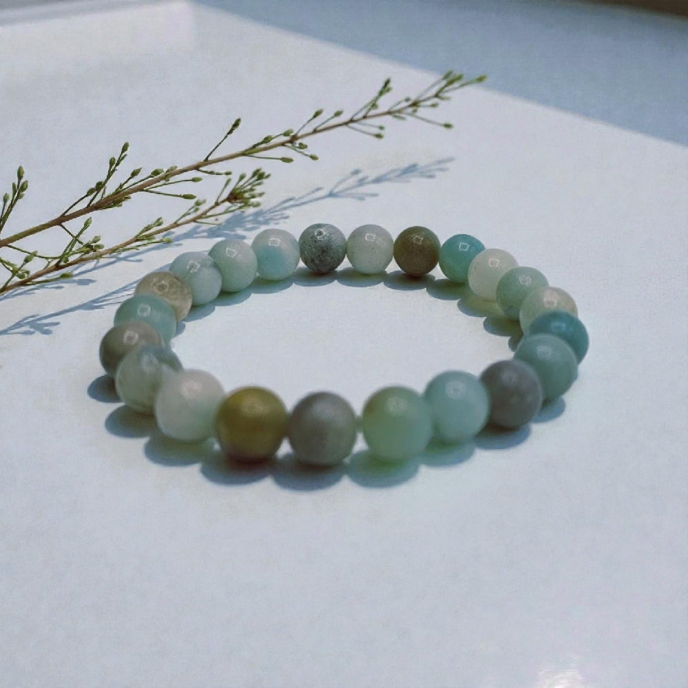 Crystal Handmade Beaded Amazonite Bracelet featuring natural stones crafted into a chakra lucky charm bracelet for both women and men. This spiritual energy jewelry combines soothing amazonite beads known for calming and balancing properties with artisanal beadwork. Lightweight and versatile, it makes a meaningful gift for anyone seeking positive energy, healing, and style. Perfect for everyday wear or meditation, blending natural beauty with holistic wellness.