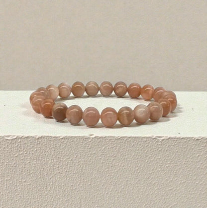 Peach moonstone beaded bracelet handcrafted from natural crystal gemstones known for promoting calm, emotional balance, and intuition. This healing jewelry piece is designed to support mindfulness, meditation, and positive energy, making it a meaningful gift for yoga lovers, spiritual seekers, or anyone drawn to crystal healing. A beautiful everyday accessory that blends boho style with intention, perfect for birthdays, self-care gifts, or personal wellness.