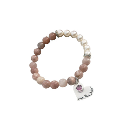 Sunstone pearl bracelet handcrafted with warm sunstone gemstones, luminous freshwater pearls, and a sterling silver charm for a boho-inspired, radiant look. This meaningful jewelry piece symbolizes joy, confidence, and positive energy, making it ideal for everyday wear or special occasions. A thoughtful gift for women who love natural stone jewelry, beachy style, or spiritual accessories, perfect for birthdays, anniversaries, holidays, or self-care gifting.
