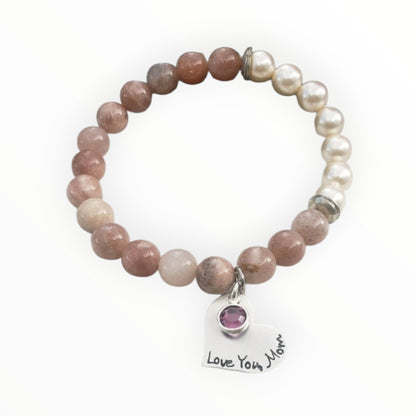 Sunstone pearl bracelet handcrafted with warm sunstone gemstones, luminous freshwater pearls, and a sterling silver charm for a boho-inspired, radiant look. This meaningful jewelry piece symbolizes joy, confidence, and positive energy, making it ideal for everyday wear or special occasions. A thoughtful gift for women who love natural stone jewelry, beachy style, or spiritual accessories, perfect for birthdays, anniversaries, holidays, or self-care gifting.