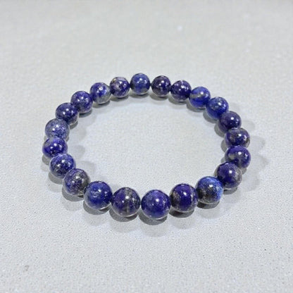 Blue Lapis Lazuli stretch bracelet for men and women, made with natural stones known for their healing and protective properties. This spiritual energy bracelet promotes mental clarity, inner peace, and positive energy. Handcrafted with care, it’s a versatile accessory that combines style and meaning, perfect as a thoughtful gift for those seeking protection, balance, and enhanced spiritual well-being in daily life.