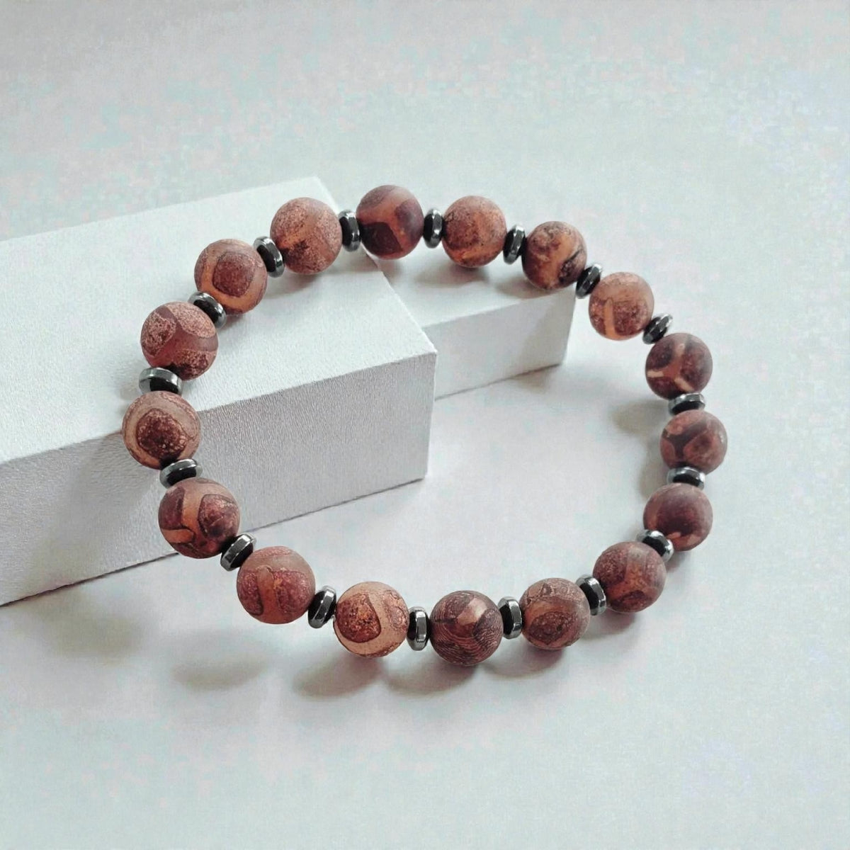 Tibetan Agate Bracelet for Men and Women – a handmade brown crystal healing bracelet featuring natural agate beads known for their grounding and protective energy. This spiritual beaded bracelet enhances balance, inner strength, and emotional healing. A thoughtful gift for him or her, perfect for meditation, daily wear, or spiritual practices. Unique handcrafted agate jewelry with timeless boho charm