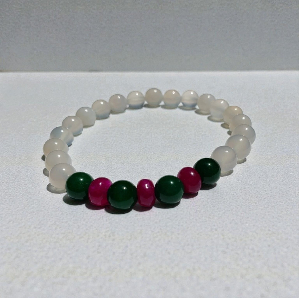 Natural White Opal and Jade Beaded Bracelet featuring 8mm stretch beads crafted for women who appreciate elegant, handmade jewelry. This lucky charm bracelet combines shimmering white opal with soothing jade stones, symbolizing balance, protection, and positive energy. Perfect gift for her on birthdays, anniversaries, or special occasions. A beautiful, versatile accessory that blends spiritual healing with stylish, artisanal craftsmanship.