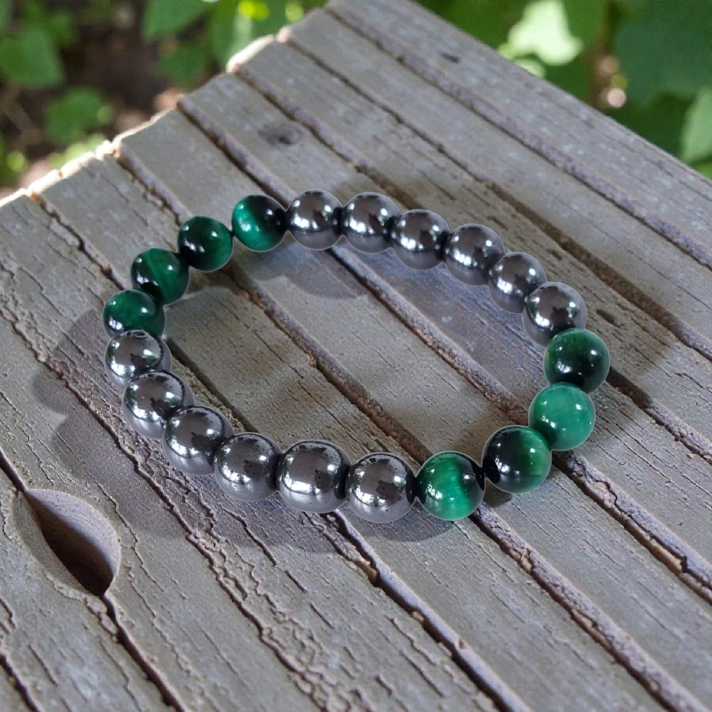 Handmade unisex bracelet featuring natural tiger eye and hematite stones, designed as a stylish lucky charm accessory for men and women. This green-hued natural stone bracelet combines grounding and protective properties, perfect for everyday wear or gifting. Crafted with care, it offers a unique blend of earthy elegance and modern style, making it a versatile jewelry piece suitable for anyone seeking both fashion and positive energy.