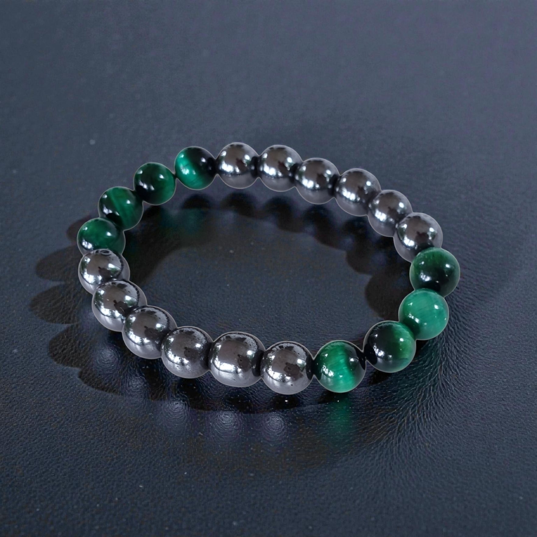Handmade unisex bracelet featuring natural tiger eye and hematite stones, designed as a stylish lucky charm accessory for men and women. This green-hued natural stone bracelet combines grounding and protective properties, perfect for everyday wear or gifting. Crafted with care, it offers a unique blend of earthy elegance and modern style, making it a versatile jewelry piece suitable for anyone seeking both fashion and positive energy.