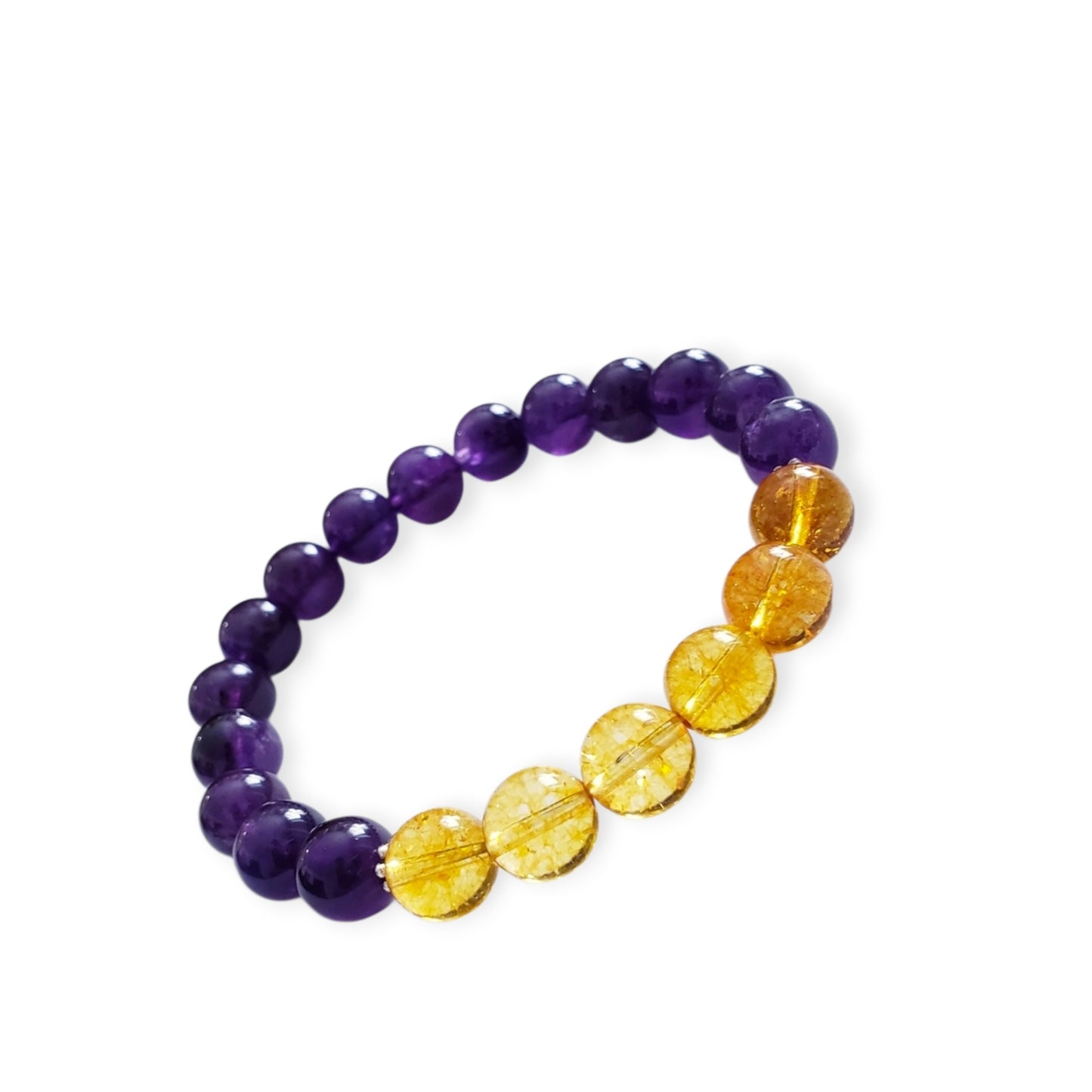 Amethyst and Citrine Crystal Bracelet for women, handcrafted with natural gemstones known for healing and positive energy. This inspirational bracelet combines the calming purple hues of amethyst with the vibrant yellow of citrine, promoting balance, clarity, and optimism. Handmade with care, it’s an ideal gift for anyone seeking spiritual wellness and stylish crystal jewelry. Perfect for everyday wear or special occasions to uplift mood and energy.