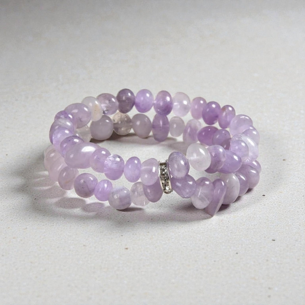 Amethyst Bracelet for Women featuring delicate lavender crystal beads handcrafted into a beautiful healing bracelet. This handmade beaded jewelry piece is designed to promote calm, balance, and spiritual well-being. Suitable as a meaningful gift for both men and women, it blends elegant style with natural energy. Perfect for everyday wear, meditation, or as a thoughtful spiritual accessory, this bracelet highlights the beauty and power of amethyst crystals in a versatile, artisanal design.