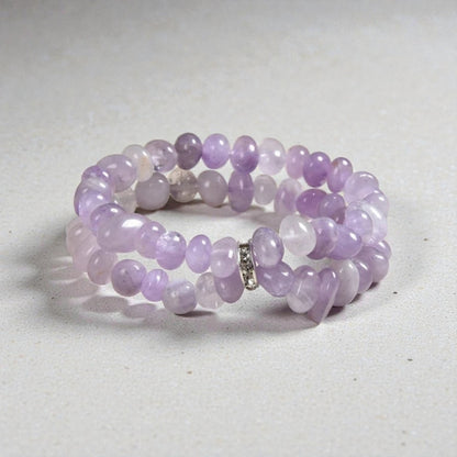 Amethyst Bracelet for Women featuring delicate lavender crystal beads handcrafted into a beautiful healing bracelet. This handmade beaded jewelry piece is designed to promote calm, balance, and spiritual well-being. Suitable as a meaningful gift for both men and women, it blends elegant style with natural energy. Perfect for everyday wear, meditation, or as a thoughtful spiritual accessory, this bracelet highlights the beauty and power of amethyst crystals in a versatile, artisanal design.