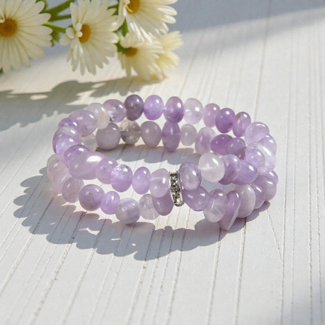 Amethyst Bracelet for Women featuring delicate lavender crystal beads handcrafted into a beautiful healing bracelet. This handmade beaded jewelry piece is designed to promote calm, balance, and spiritual well-being. Suitable as a meaningful gift for both men and women, it blends elegant style with natural energy. Perfect for everyday wear, meditation, or as a thoughtful spiritual accessory, this bracelet highlights the beauty and power of amethyst crystals in a versatile, artisanal design.