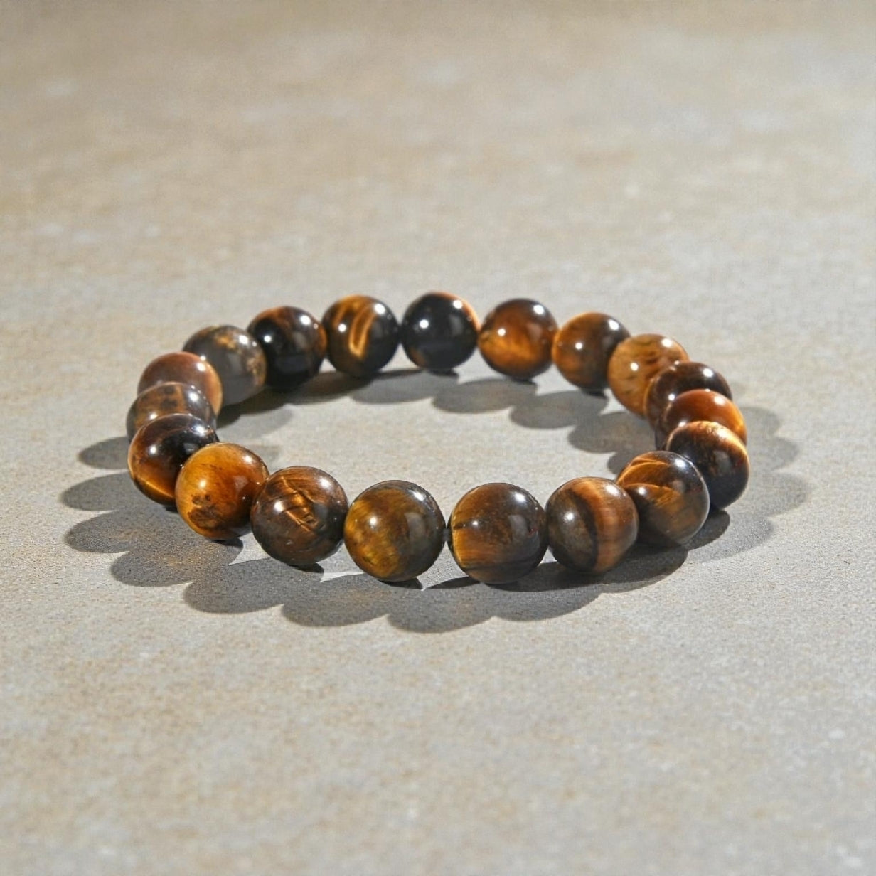 Tiger Eye Bracelet for men featuring natural healing crystals known for protection, strength, and balance. This stylish spiritual jewelry is designed to promote positive energy and calm, making it a meaningful gift for him—perfect for husbands or boyfriends. Handmade with quality beads, it combines durability and fashion for everyday wear. Ideal for meditation, casual outfits, or special occasions, blending wellness with masculine style.