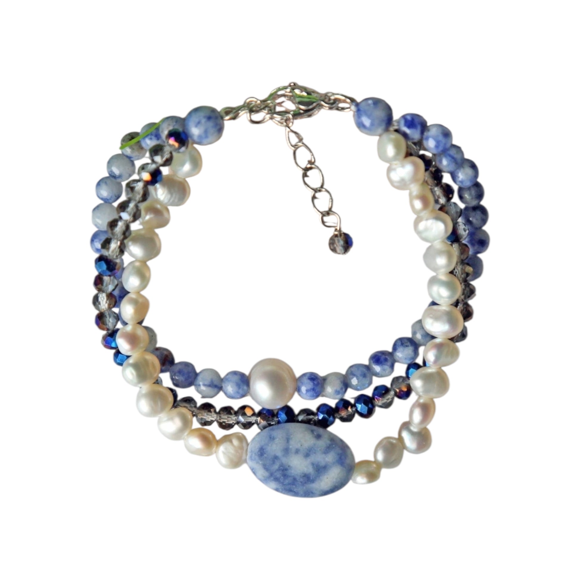 Handmade multi-strand bracelet featuring sodalite and cultured pearl beads, designed as chunky crystal jewelry with a minimalist pendant accent. This beaded bracelet offers a stylish and elegant accessory perfect for girls who love unique, handcrafted pieces. Combining natural gemstones with delicate craftsmanship, it makes a thoughtful gift ideal for special occasions or everyday wear, blending boho charm with modern minimalist style.