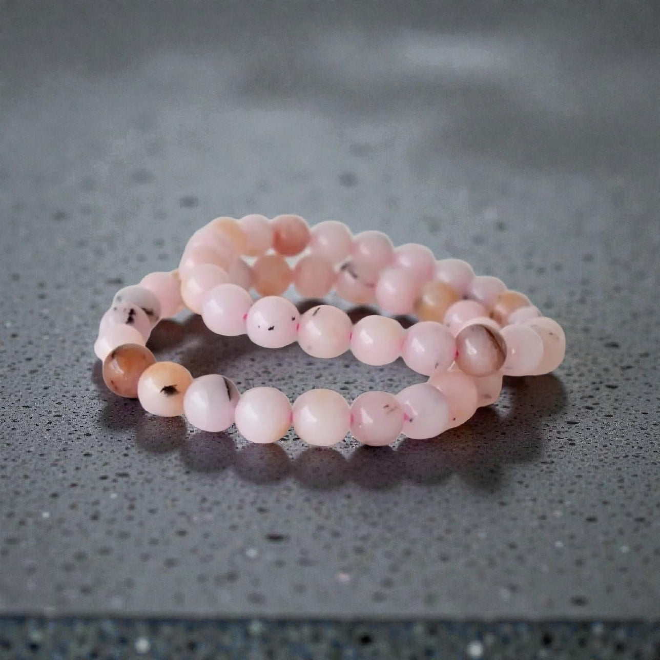 Pink Opal Bracelet featuring natural stone beads handcrafted into a soft pink crystal gemstone design, perfect for women who love healing and elegant jewelry. This delicate bracelet promotes emotional healing, love, and calm energy, making it an ideal gift for her or a thoughtful bridesmaid bracelet. Lightweight and feminine, it blends artisanal craftsmanship with the gentle beauty of pink opal, suitable for everyday wear or meaningful special occasions.