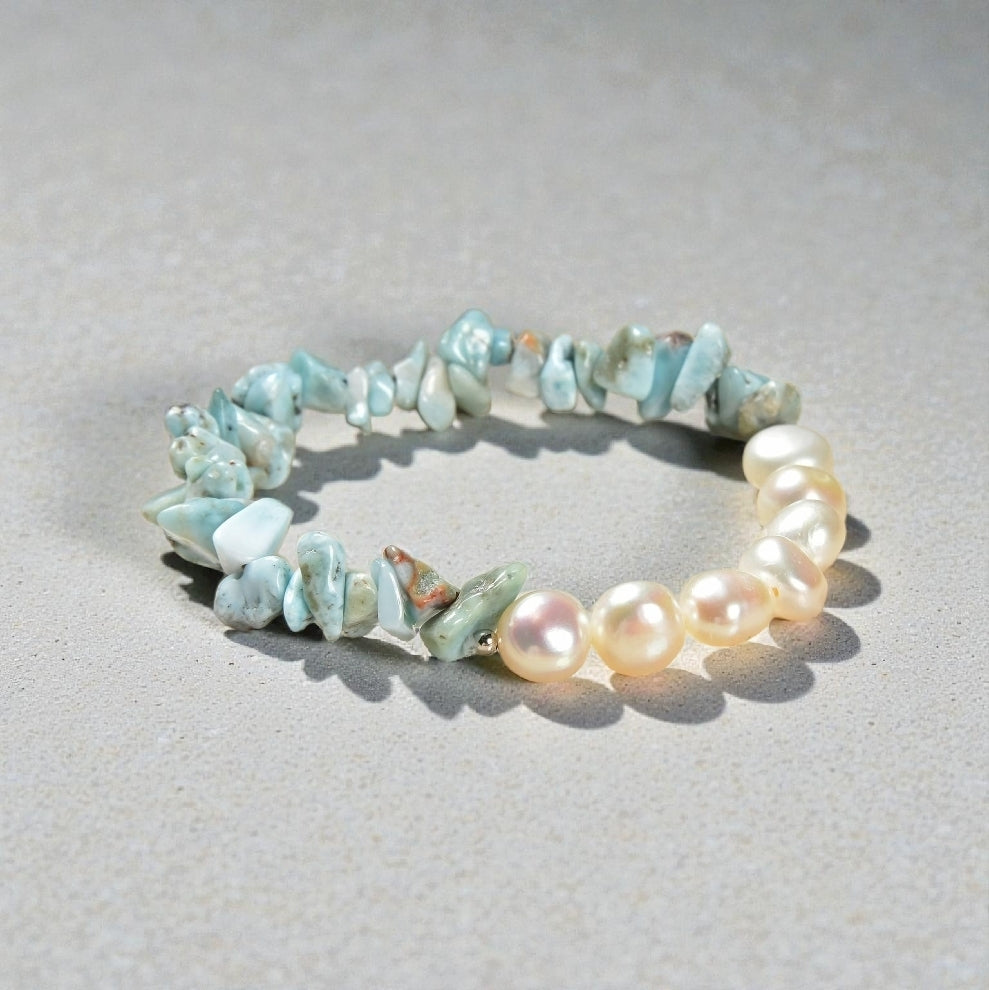 Larimar bracelet paired with cultured freshwater pearls, designed as a soft, tropical-inspired stretch bracelet for women. Featuring ocean blue larimar stones and luminous pearls, this handmade jewelry piece evokes beachside calm and coastal elegance. Perfect as a summer accessory, vacation jewelry, or thoughtful gift for birthdays, holidays, or beach lovers, this bracelet blends natural beauty, comfort, and effortless style for everyday wear or special occasions.