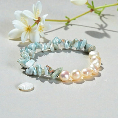 Larimar bracelet paired with cultured freshwater pearls, designed as a soft, tropical-inspired stretch bracelet for women. Featuring ocean blue larimar stones and luminous pearls, this handmade jewelry piece evokes beachside calm and coastal elegance. Perfect as a summer accessory, vacation jewelry, or thoughtful gift for birthdays, holidays, or beach lovers, this bracelet blends natural beauty, comfort, and effortless style for everyday wear or special occasions.