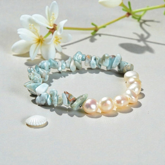 Larimar bracelet paired with cultured freshwater pearls, designed as a soft, tropical-inspired stretch bracelet for women. Featuring ocean blue larimar stones and luminous pearls, this handmade jewelry piece evokes beachside calm and coastal elegance. Perfect as a summer accessory, vacation jewelry, or thoughtful gift for birthdays, holidays, or beach lovers, this bracelet blends natural beauty, comfort, and effortless style for everyday wear or special occasions.