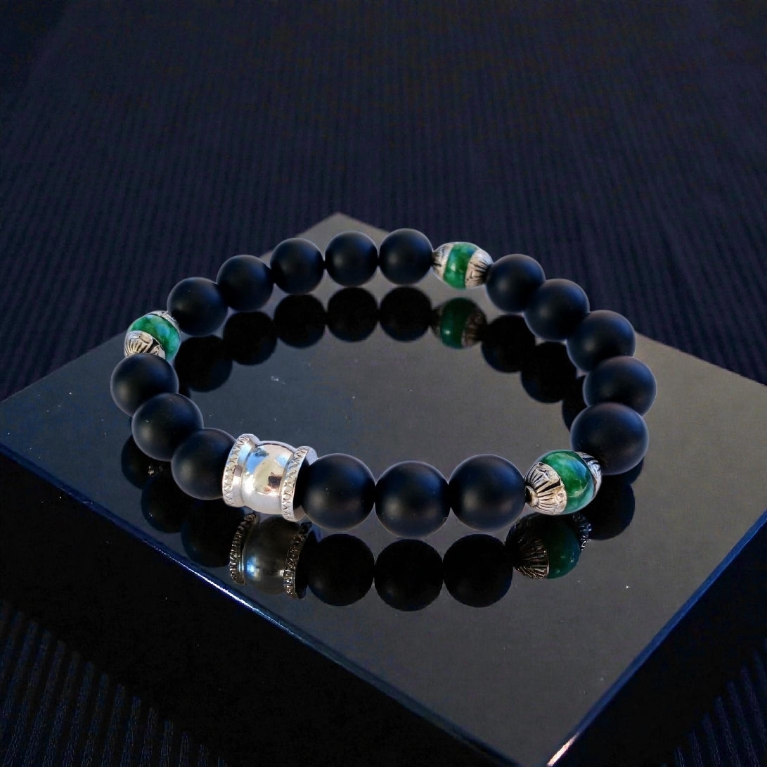 Natural Jade and Black Onyx Bracelet handcrafted as a men’s lucky charm and protection armband. This healing jewelry piece combines smooth jade and powerful black onyx stones, designed for strength, balance, and spiritual protection. Perfect handmade gift for him, ideal for birthdays, anniversaries, or wellness gifts. Stylish and meaningful, this men’s stretch bracelet blends natural energy with everyday wearable craftsmanship.