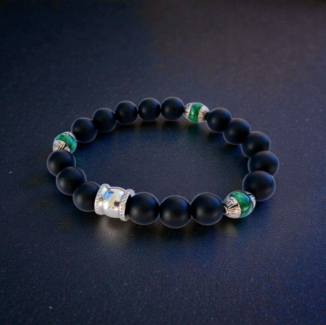 Natural Jade and Black Onyx Bracelet handcrafted as a men’s lucky charm and protection armband. This healing jewelry piece combines smooth jade and powerful black onyx stones, designed for strength, balance, and spiritual protection. Perfect handmade gift for him, ideal for birthdays, anniversaries, or wellness gifts. Stylish and meaningful, this men’s stretch bracelet blends natural energy with everyday wearable craftsmanship.