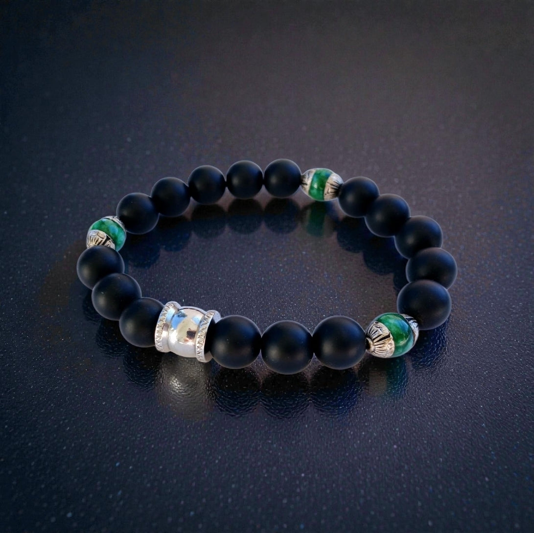 Natural Jade and Black Onyx Bracelet handcrafted as a men’s lucky charm and protection armband. This healing jewelry piece combines smooth jade and powerful black onyx stones, designed for strength, balance, and spiritual protection. Perfect handmade gift for him, ideal for birthdays, anniversaries, or wellness gifts. Stylish and meaningful, this men’s stretch bracelet blends natural energy with everyday wearable craftsmanship.