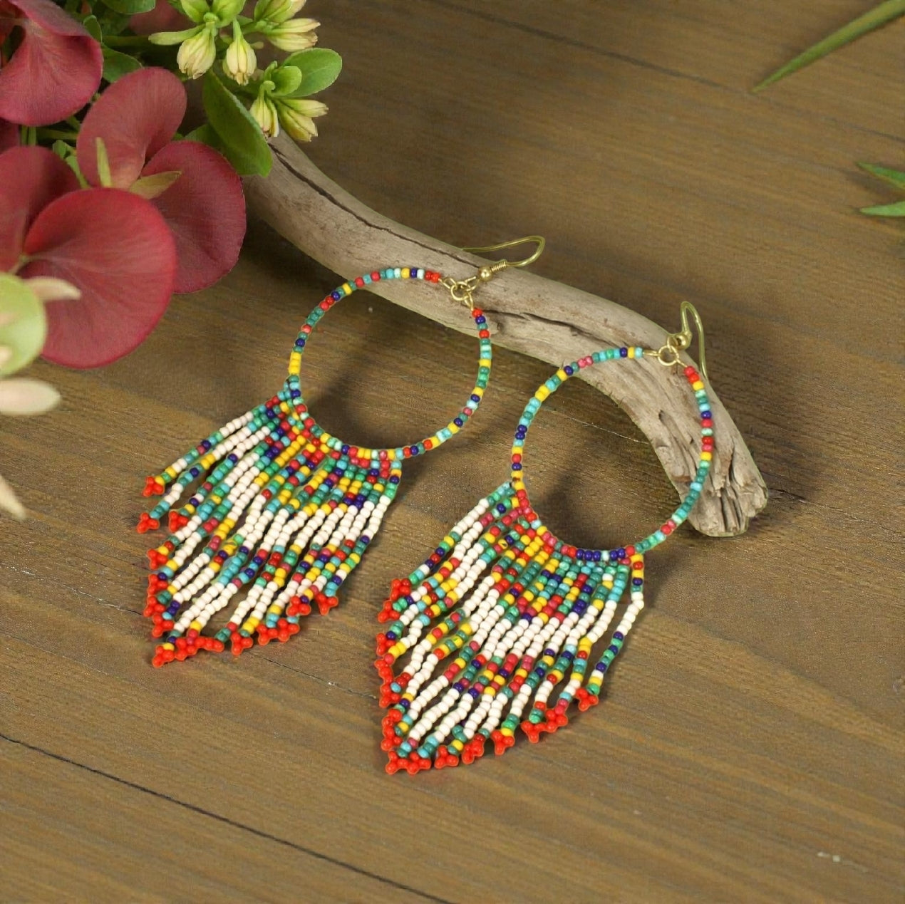 Multi Color Beaded Handmade Earrings for women featuring vibrant bohemian ethnic design with colorful crystals and tassels. These retro large hoop statement earrings combine intricate beadwork and bright hues for a bold, eye-catching accessory. Perfect for festivals, casual wear, or special occasions, these handmade earrings add a playful, artistic touch to any outfit. Ideal gift for women who love unique, colorful artisan jewelry with a boho vibe.