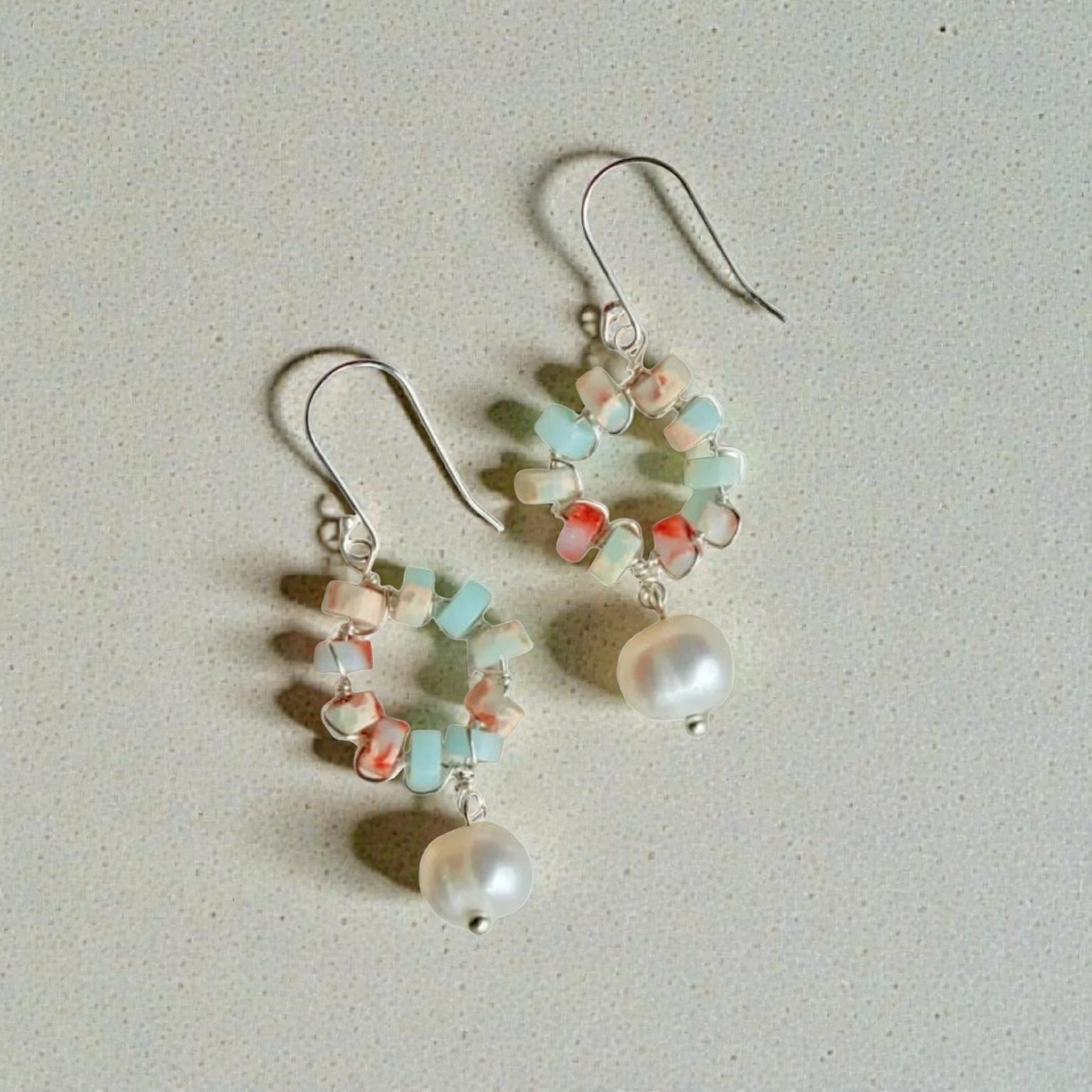 Cultured Pearl Sterling Silver Earrings featuring elegant handmade beadwork, perfect for women who appreciate timeless, sophisticated jewelry. These delicate earrings combine the classic beauty of lustrous pearls with sterling silver craftsmanship, making them an ideal bridesmaid gift or elegant wedding accessory. Lightweight and refined, they add a graceful touch to any bridal or formal outfit, blending artisanal artistry with enduring style for special occasions or everyday elegance.