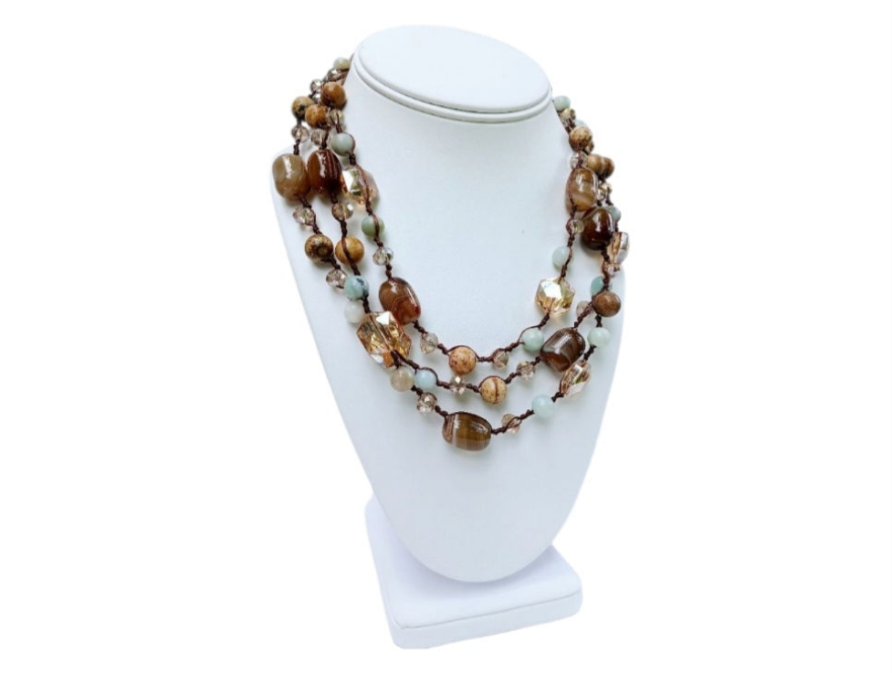 Double knotted 17-inch necklace featuring agate, amazonite, and jasper crystals with a sterling silver clasp. This spiritual healing gemstone jewelry combines natural stones known for their calming and balancing properties. Handmade with care, the necklace offers both style and wellness benefits. Perfect as a thoughtful gift for her, it complements boho and mindful fashion, adding a meaningful touch to any outfit with its earthy, healing vibe